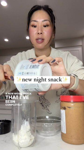 a woman is pouring something into a jar