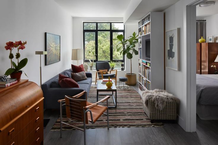 a living room filled with furniture and a flat screen tv