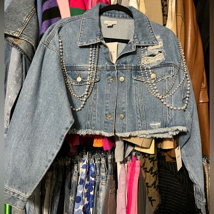 Cropped Denim Jacket With Embellishments Size: L Never Worn Still Has Tag Raw Edge Cut Trendy Forever 21 Denim Jacket For Spring, Forever 21 Denim Jacket In Medium Wash For Fall, Forever 21 Medium Wash Denim Jacket For Fall, Forever 21 Medium Wash Denim Jacket For Spring, Forever 21 Denim Jacket For Fall, Forever 21 Trendy Cropped Jacket For Spring, Trendy Forever 21 Cropped Jacket For Spring, Forever 21 Blue Denim Jacket For Spring, Forever 21 Denim Jacket For Spring