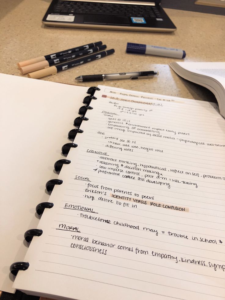 an open notebook sitting on top of a table