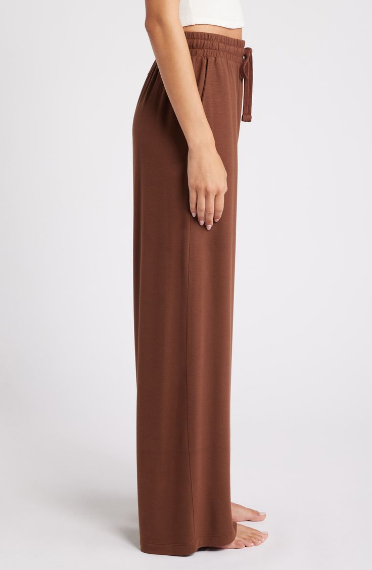 Feel the soft comfort of these lounge-worthy pants punctuated with flowy wide legs. 29" inseam; 26" leg opening; 12" front rise; 15" back rise (size medium) Elastic/drawstring waist Side pockets 95% Tencel® modal, 5% spandex Tencel modal is a sustainably produced fiber made with closed-loop processing and is certified with the EU Ecolabel as having a low environmental impact throughout the entire lifecycle Machine wash, dry flat Imported Wide Legs, Environmental Impact, Drawstring Waist, Leg Pants, Wide Leg Pants, Wide Leg, Nordstrom, Size Medium, Pants