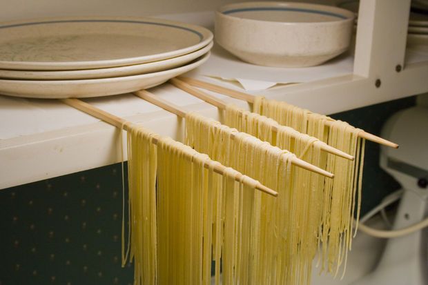 some noodles are being cooked on the stove