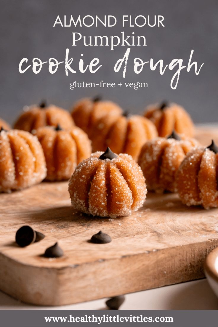 pumpkin cookie doughnuts on a cutting board with chocolate chips