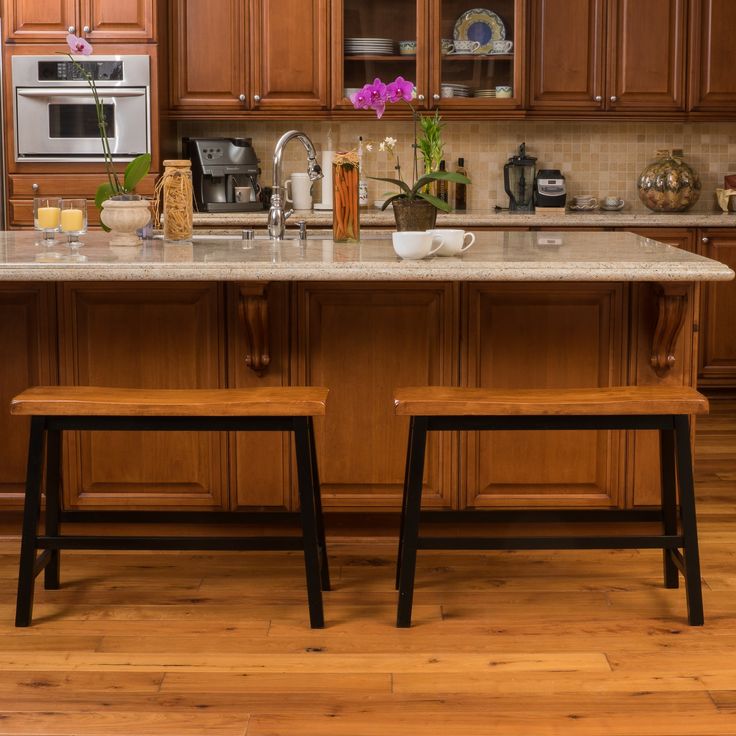 two stools sit in front of the kitchen island