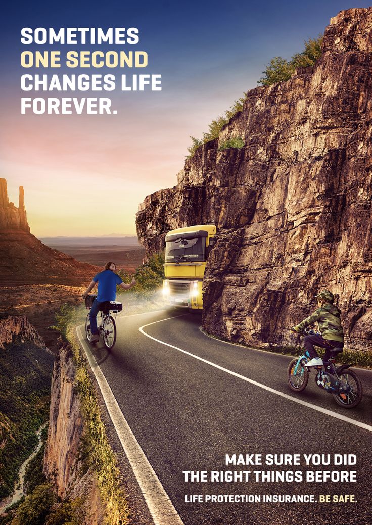 two bicyclists riding down the road in front of a bus and mountains