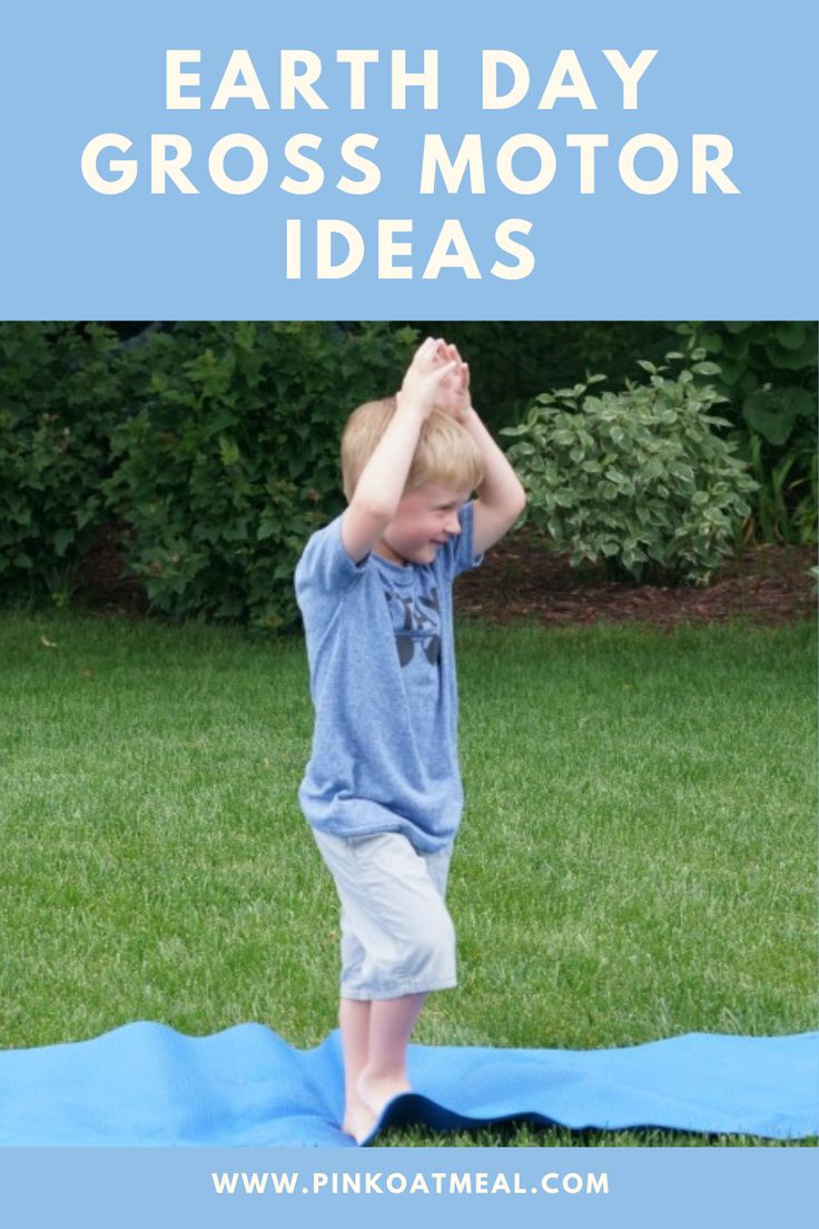 a young boy standing on top of a blue blanket in the grass with text overlay that reads, earth day gross motor ideas