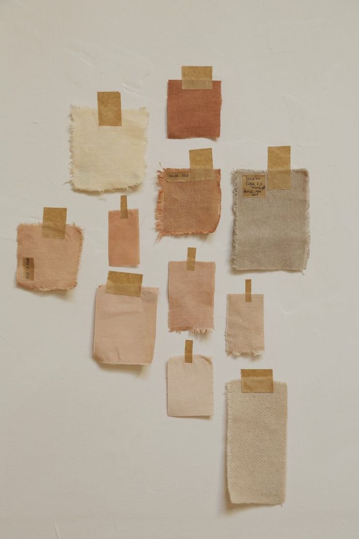 several pieces of cloth with brown and tan patches on them