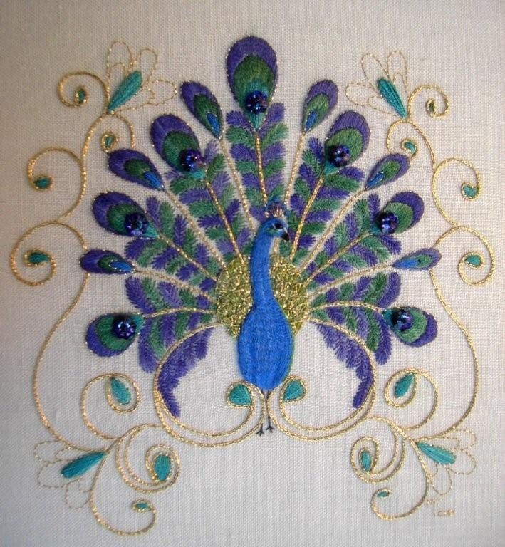 a blue and green peacock with gold trimmings on it's back side