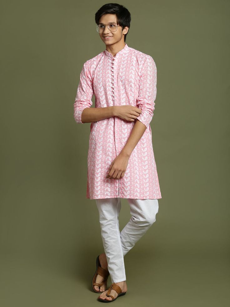 YUVA BY VASTRAMAY Boys' Pink Chaikankari Kurta With White Pyjama Set Get your little one a stylish and comfortable ethnic outfit. This set features a pink cotton kurta with intricate Lucknowi chikankari embroidery all over. The kurta has a mandarin collar, long sleeves, and button closure. It comes with a relaxed fit cotton pyjama in white for a complete look. Key Features Pink cotton kurta with chikankari embroidery Mandarin collar Long sleeves Button closure Relaxed fit cotton pyjama in white Pink Long Sleeve Traditional Wear With Chikankari Embroidery, Traditional Pink Tunic Sets, Pink Kurta With Chikankari Embroidery For Transitional Season, Transitional Pink Kurta With Chikankari Embroidery, Pink Long Sleeve Sets With Bandhani Print, Casual Sets With Resham Embroidery For Spring, Pink Cotton Kurta With Bandhani Print, Casual Cotton Chikankari Embroidery Sets, Casual Cotton Traditional Wear For Eid