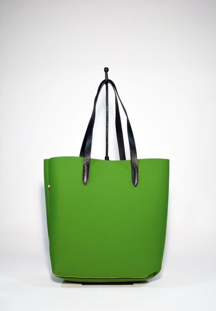 A fresh and modern style Neoprene Tote Bag-Green is made from high quality Neoprene.The minimalist design of this soft and sturdy tote bag suits any outfit and makes it a perfect every day bag. Ideal for the gym, study, travel, work, as baby bag or as an every day bag. Raw edges and no lining makes this style super light and easy to fold when traveling. Details:Color: greenMaterial: Soft neoprene Fits a laptop (up to 15 inch)inside zipped loose pocket to store your valuablesLeather shoulder stra Green Rectangular Laptop Bag For On-the-go, Modern Green Bucket Bag With Leather Handles, Trendy On-the-go Tote Laptop Bag, Modern Large Capacity Canvas Bag For On-the-go, Green Canvas Bag With Adjustable Strap For On-the-go, Green Tote Diaper Bag For Travel, Green Tote Diaper Bag For Everyday Use, Everyday Green Tote Diaper Bag, Green Canvas Bag With Leather Handles For On-the-go