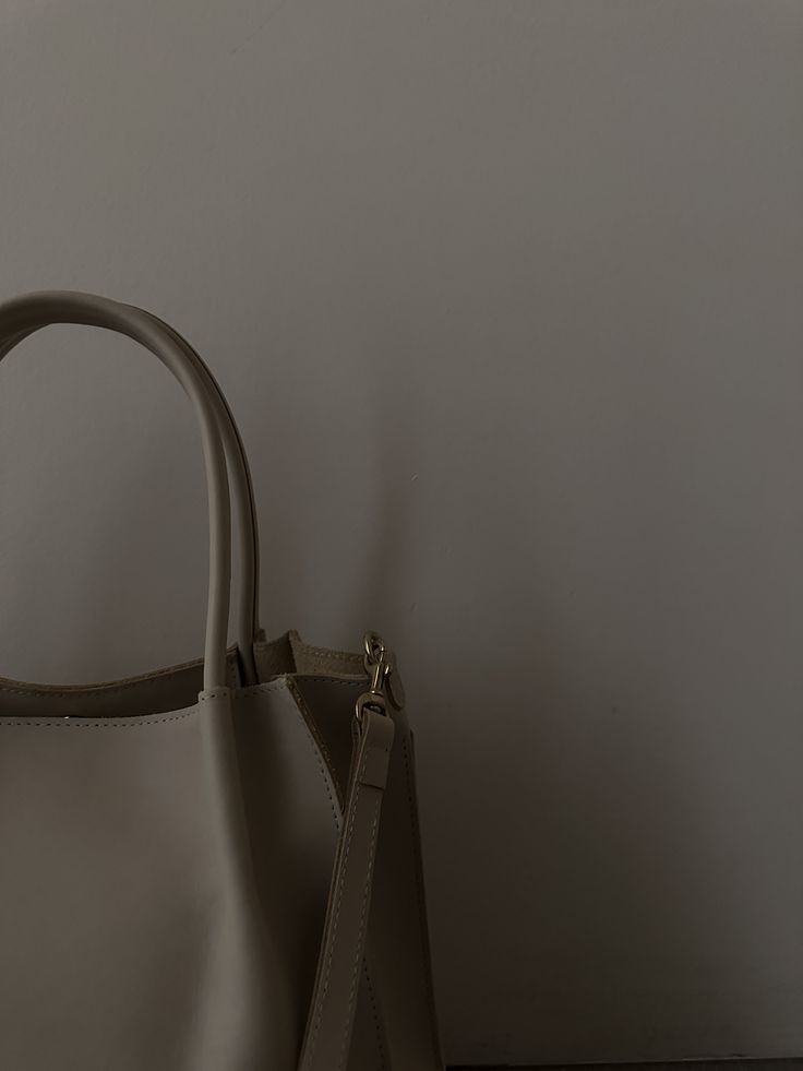 The structured, elevated older sister to our zoe tote. Detachable Crossbody/ Shoulder Strap. Tab with Magnetic Snap Closure. Unlined with Open Pocket & Zip Pocket. Dimensions: 13.5" in W at the top, 12" in W at the bottom, 10.75" in H x 6" in D. 6.5 inch Top Handle Drop Materials: Dakota Cowhide Leather- made ethically + tanned in the USA. Solid Brass Hardware. Return Policy Timeless Everyday Shoulder Bag With Rolled Handles, Everyday Timeless Shoulder Bag With Rolled Handles, Timeless Everyday Bags With Rolled Handles, Classic Shoulder Bag With Top Handle And Rolled Handles, Elegant Everyday Satchel With Rolled Handles, Timeless Satchel With Handles For Shopping, Timeless Shoulder Bag With Rolled Handles For Everyday Use, Timeless Shoulder Bag With Double Rolled Handles, Elegant Bucket Bag With Adjustable Handle