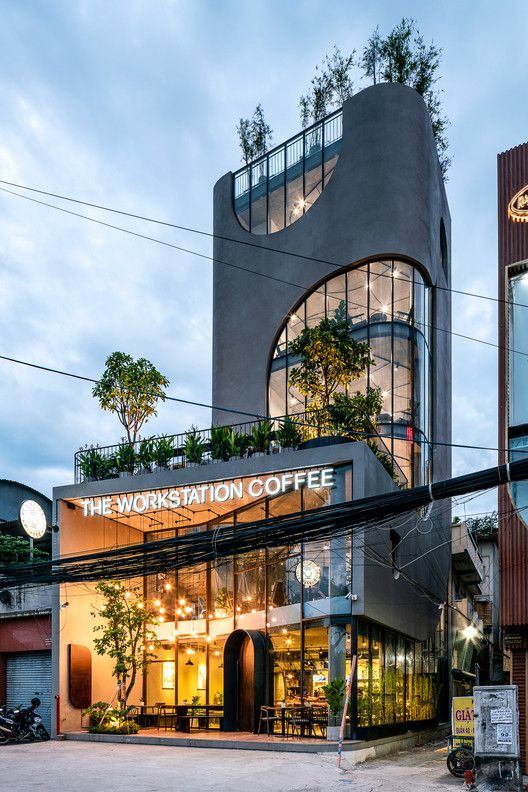 the building has plants growing on it's roof