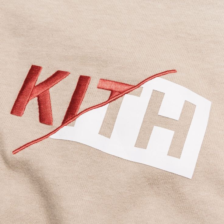 the letters are cut out and placed on top of a t - shirt that says kit