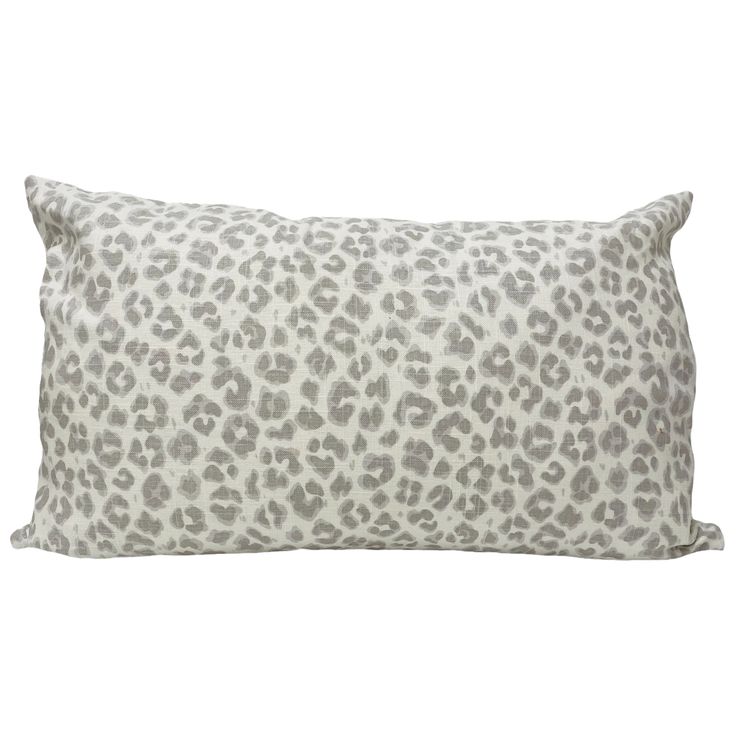 a grey and white leopard print pillow on a white background