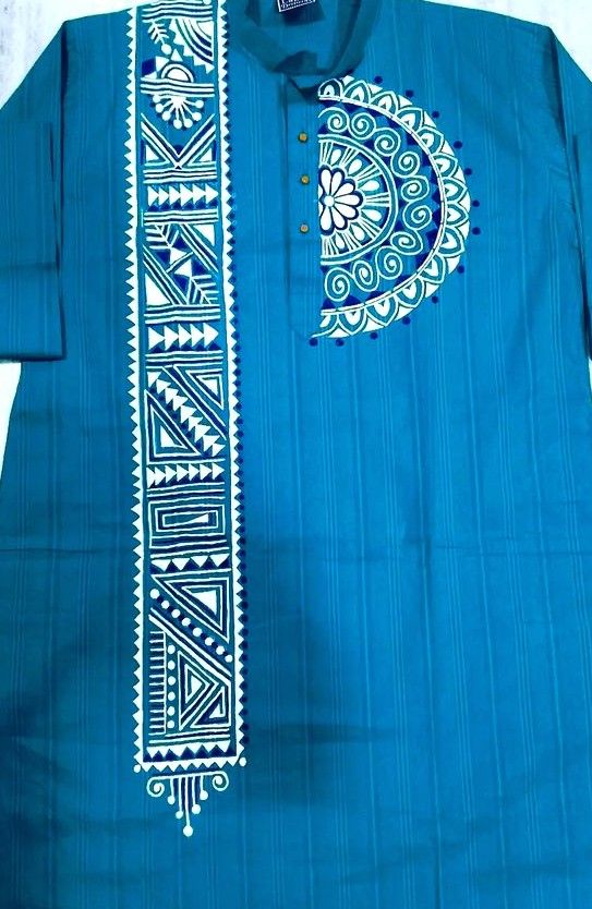 a blue shirt with white designs on it