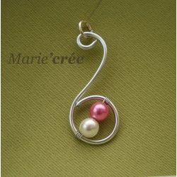 a necklace with two pearls hanging from it's end and the word mariere written in