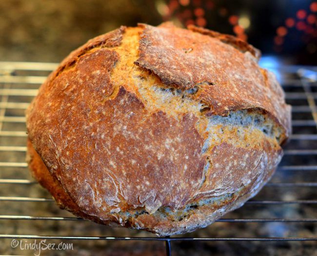 a loaf of bread sitting on top of a cooling rack