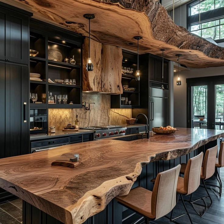 a large wooden table sitting in the middle of a kitchen