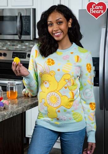 a woman standing in a kitchen holding an orange