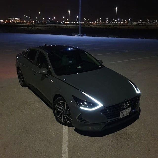 a car parked in a parking lot at night