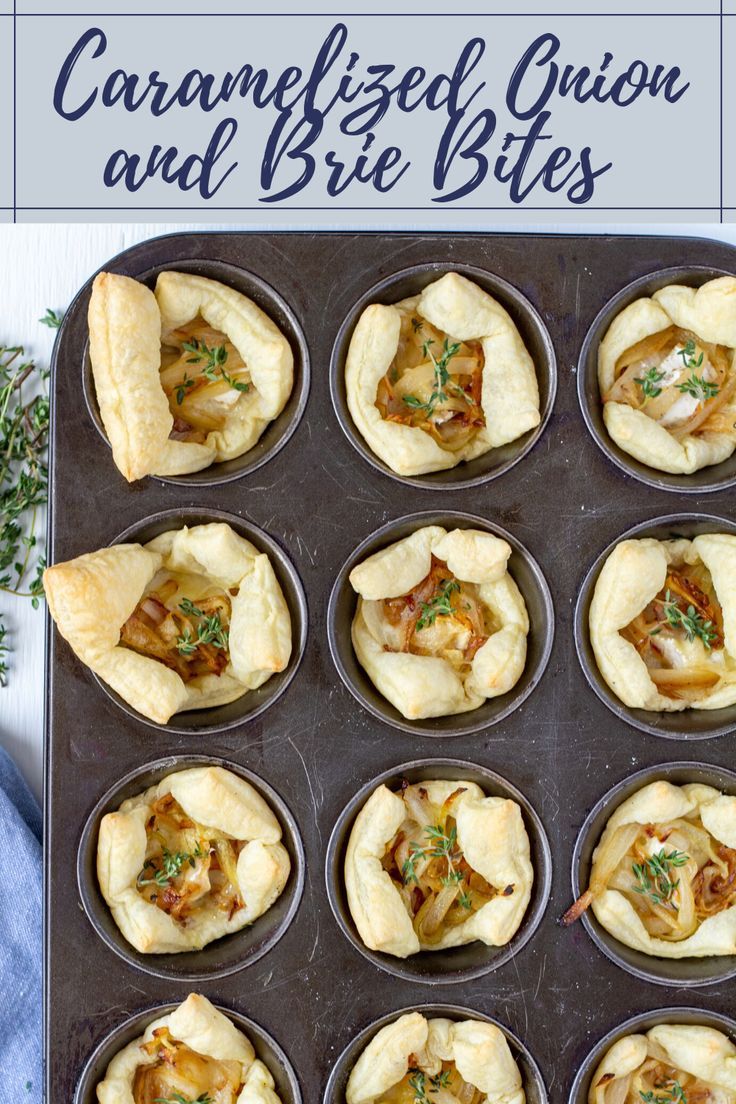 a muffin tin filled with mini pies on top of a blue towel next to a sprig of rosemary