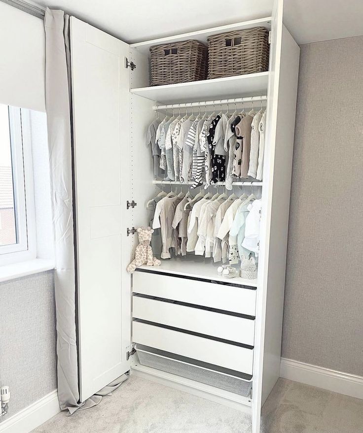 an organized closet with clothes and baskets