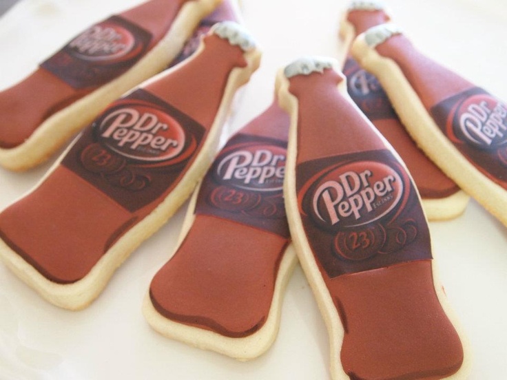 cookies shaped like hot dogs with dr pepper on them