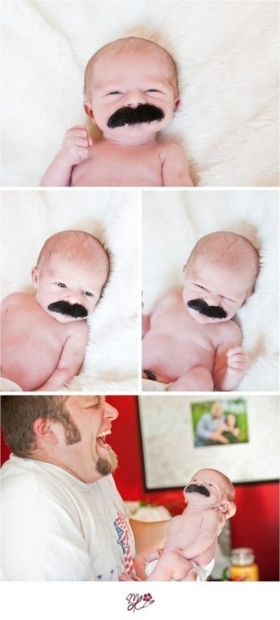 there is a baby with a fake moustache on it's face and mustache