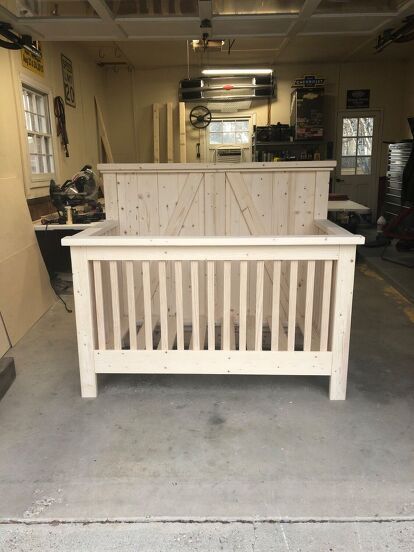 a white bench sitting in the middle of a garage