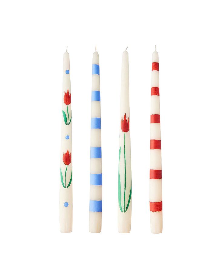 three candles with flowers painted on them