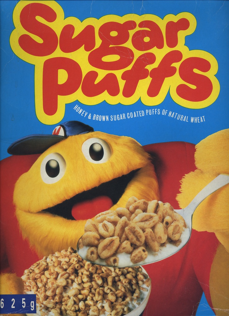 a cereal box with an animal holding a spoon full of cereal and peanuts on it