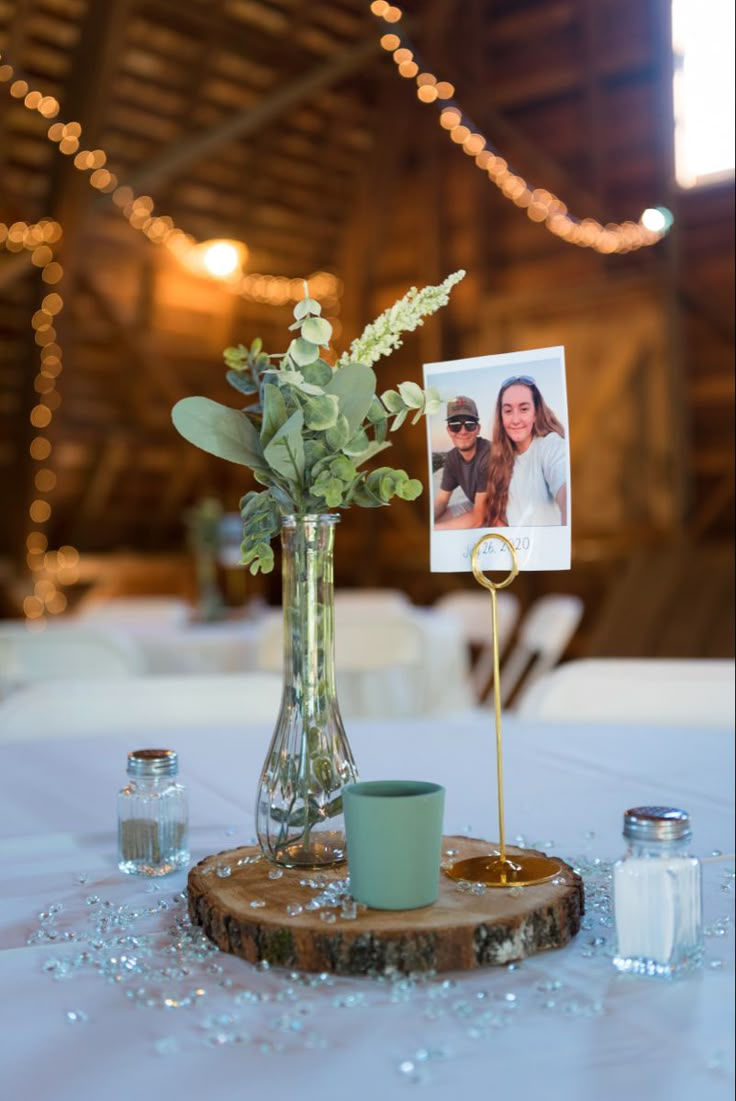 a vase filled with flowers sitting on top of a table