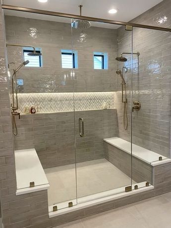 a walk in shower sitting inside of a bathroom