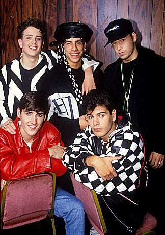 a group of young men sitting next to each other