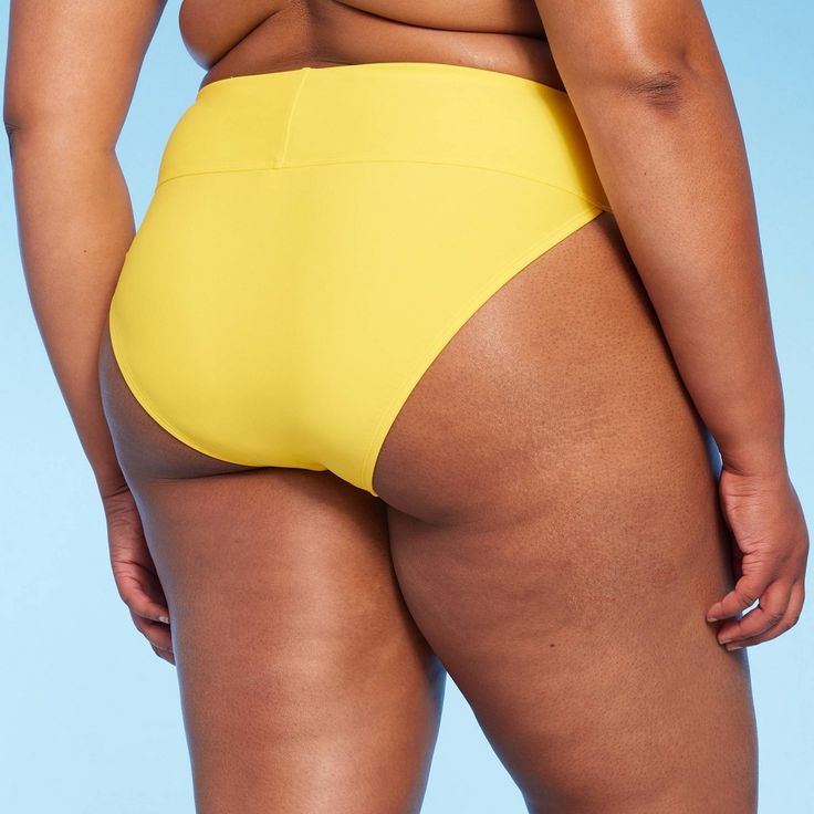 Cheeky bikini bottom from Wild Fable™ in solid yellow tailored in a flattering high-waist, extra high-leg silhouette. Made from soft fabric with spandex and full lining for stretchy comfort and coverage. Pull-on style makes it easy to put on and take off. If you're not satisfied with any Target Owned Brand item, return it within one year with a receipt for an exchange or a refund. Wild Fable™: A look for every story. Bold Fitted Bottoms For Poolside, High Waist Yellow Bottoms For Poolside, Bold Stretch Bottoms For The Beach, Bold Summer Bottoms For Poolside, High Waist Yellow Beachwear Bottoms, Yellow Bottoms For Pool, Yellow High Waist Bottoms For Beach Season, Yellow Bottoms For Poolside, High-waist Yellow Bottoms For Beach Season