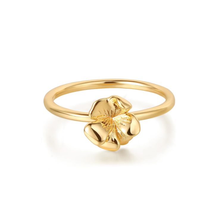 a gold flower ring on a white background