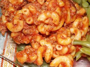 some pasta and green beans on a plate