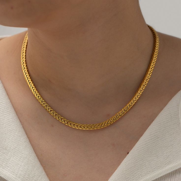 Step up your accessory game with the Francesca Gold Necklace. Crafted from high-quality titanium steel and finished with an 18k gold coating, this piece brings a touch of elegance and durability to your collection. The Franco chain design adds a unique, textured look that pairs well with both casual and formal outfits. Whether you’re dressing up for a night out or adding a chic detail to your everyday ensemble, this necklace is a versatile must-have Franco chain 16" + 2" extension. Non-fading, w Formal Metal Necklace Tarnish Resistant, Luxury Stainless Steel Yellow Gold Necklaces, Luxury Yellow Gold Stainless Steel Necklace, Luxury Gold Stainless Steel Necklace, Luxury Stainless Steel Yellow Gold Necklace, Modern Yellow Gold Stainless Steel Chain Necklace, Elegant Stainless Steel Chain Necklace, Gold Wheat Chain Necklace In Stainless Steel, Gold Stainless Steel Necklace With Wheat Chain