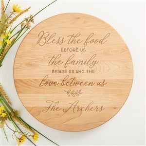 a wooden plaque that says, blessing the food before us is the family beside us and the love between us