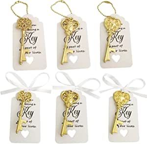 six gold key tags tied to each other with white ribbon and heart - shaped keys