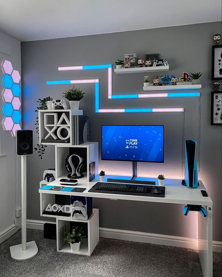 a desk with a computer and speakers on it