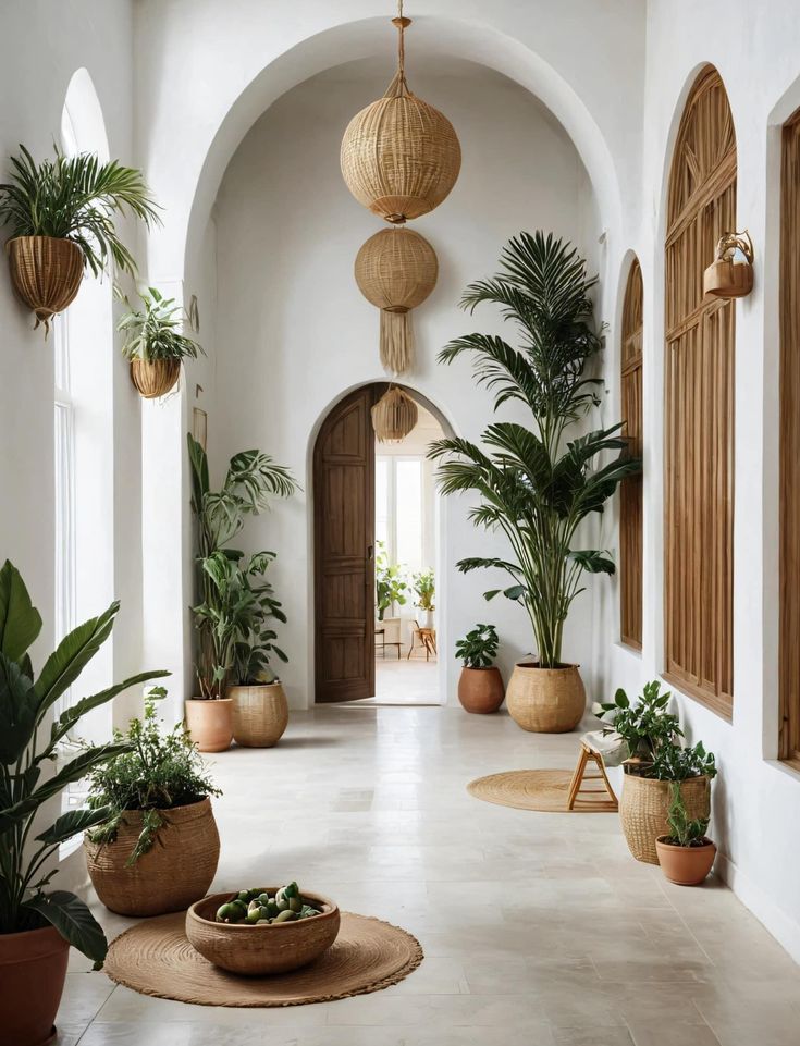 a hallway with potted plants and hanging lights