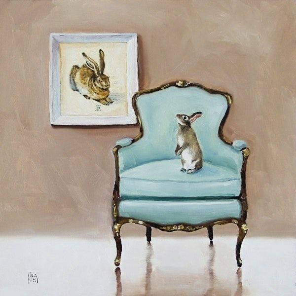 a painting of a rabbit sitting on top of a blue chair next to a framed bunny