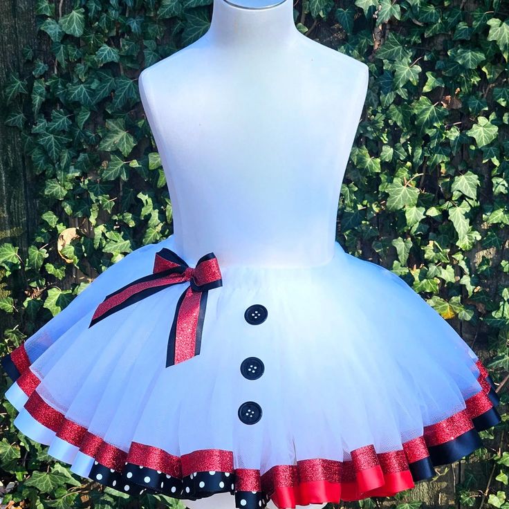 Stay toasty and look oh-so-cute in our Snowman Girl Costume/Tutu Set! Crafted with 100% cotton and premium tulle, this eye-catching outfit will bring a flurry of joy to your little one's winter adventures. Featuring an adorable snowman design with a carrot nose and coal eyes, plus a dazzling tutu skirt that will make winter festivities even more twirl-worthy – it's the must-have ensemble for snow days, holiday parties, and festive photoshoots! Embrace the frosty magic of winter! Ready to snowbal White Fitted Tutu Dress For Playtime, Cute Fitted Christmas Tutu Dress, Cute Fitted Tutu Dress For Christmas, Playful Tulle Tutu Dress For Playtime, Cute Tulle Tutu Dress For Playtime, Cute White Tulle Tutu Dress, Cute Cotton Tutu Dress For Dress-up, White Fun Tutu Dress For Party, White Tulle Tutu Dress For Christmas