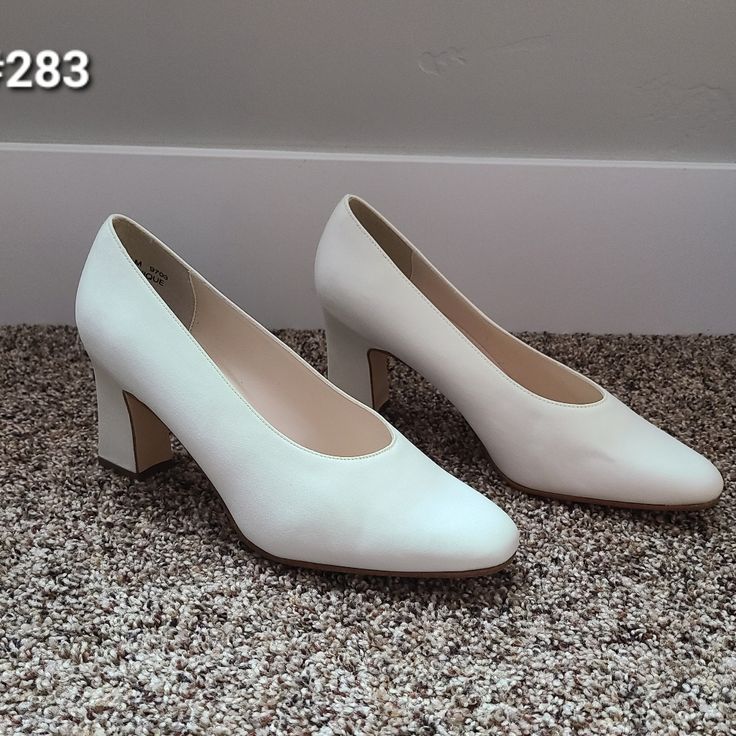 Ivory Pumps. 2.5" Chunky Heels. Rounded Toe. Coloriffics Brand. New Condition. Slight Flaw As Pictured. Formal Cream Court Shoes With 4-inch Heel, Cream Court Shoes With Sculpted Low Heel, Elegant Cream Court Shoes Medium Width, Classic White Heels With Medium Width, Fitted Cream Court Shoes With Sculpted Heel, Classic White Square Toe Heels, Cream Square Toe Heels For Formal Occasions, Classic Cream Block Heel Shoes, Formal Cream Heels Of Medium Width