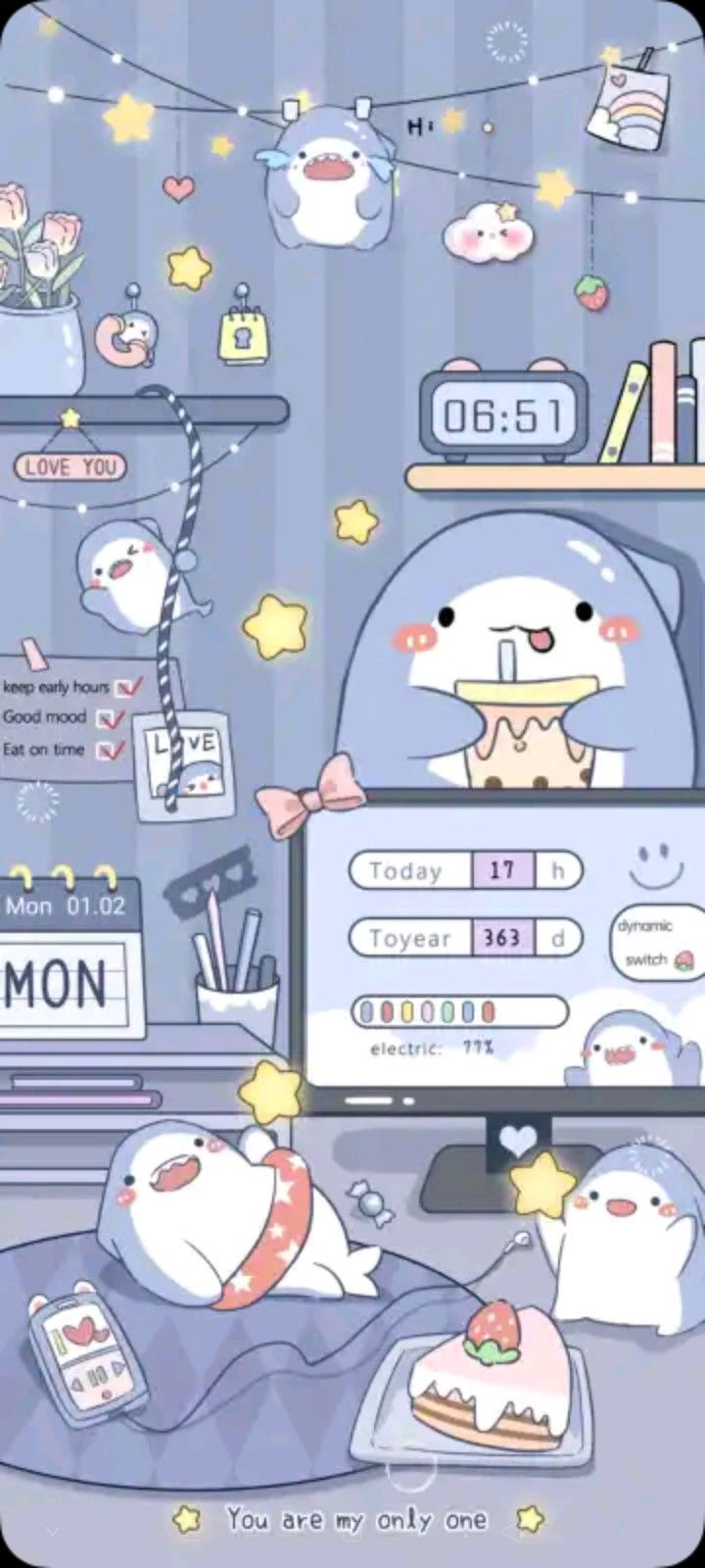 a computer screen with an image of cats on it and other items in the background