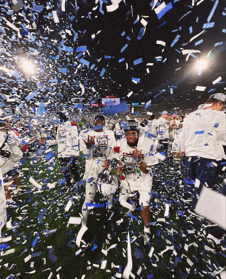 the football players are surrounded by confetti and streamers