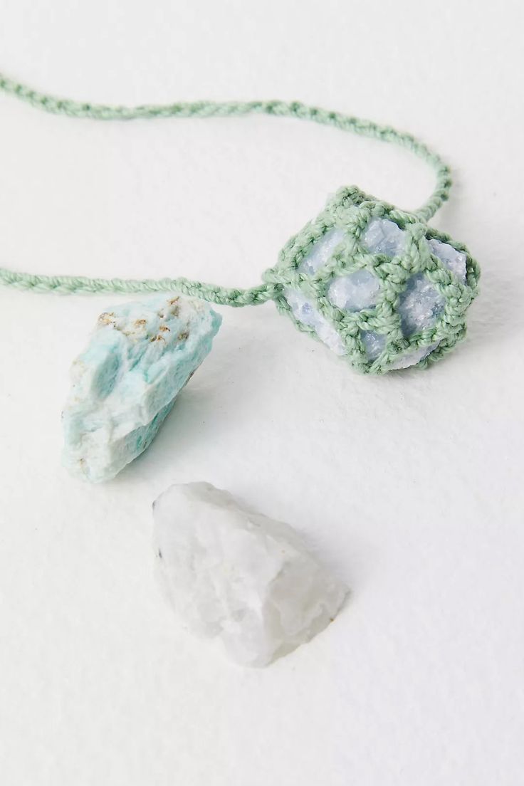 Experience the unique blend of artistry and nature with the exquisite Crochet Healing Crystal Necklace. Handcrafted in our vibrant NYC studio, this stunning piece features a delicate crochet design that beautifully cradles an enchanting Aura Quartz stone pendant. Each necklace showcases the highest level of craftsmanship, making it a perfect addition for those who cherish handmade artistry. The Crochet Healing Crystal Necklace is more than just a fashion accessory; it is a versatile tool for per Adjustable Crochet Jewelry For Festivals, Bohemian Raw Stone Pendant Jewelry, Adjustable Crochet Necklace For Festivals, Bohemian Turquoise Crochet Jewelry, Adjustable Crochet Necklaces For Festivals, Adjustable Bohemian Necklace With Raw Stone, Bohemian Necklace With Raw Mineral Crystal Stone, Bohemian Adjustable Raw Stone Necklace, Bohemian Pendant Necklace With Raw Stone