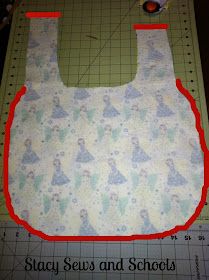 an image of a bib made out of fabric on a cutting board with the words stay sews and schools