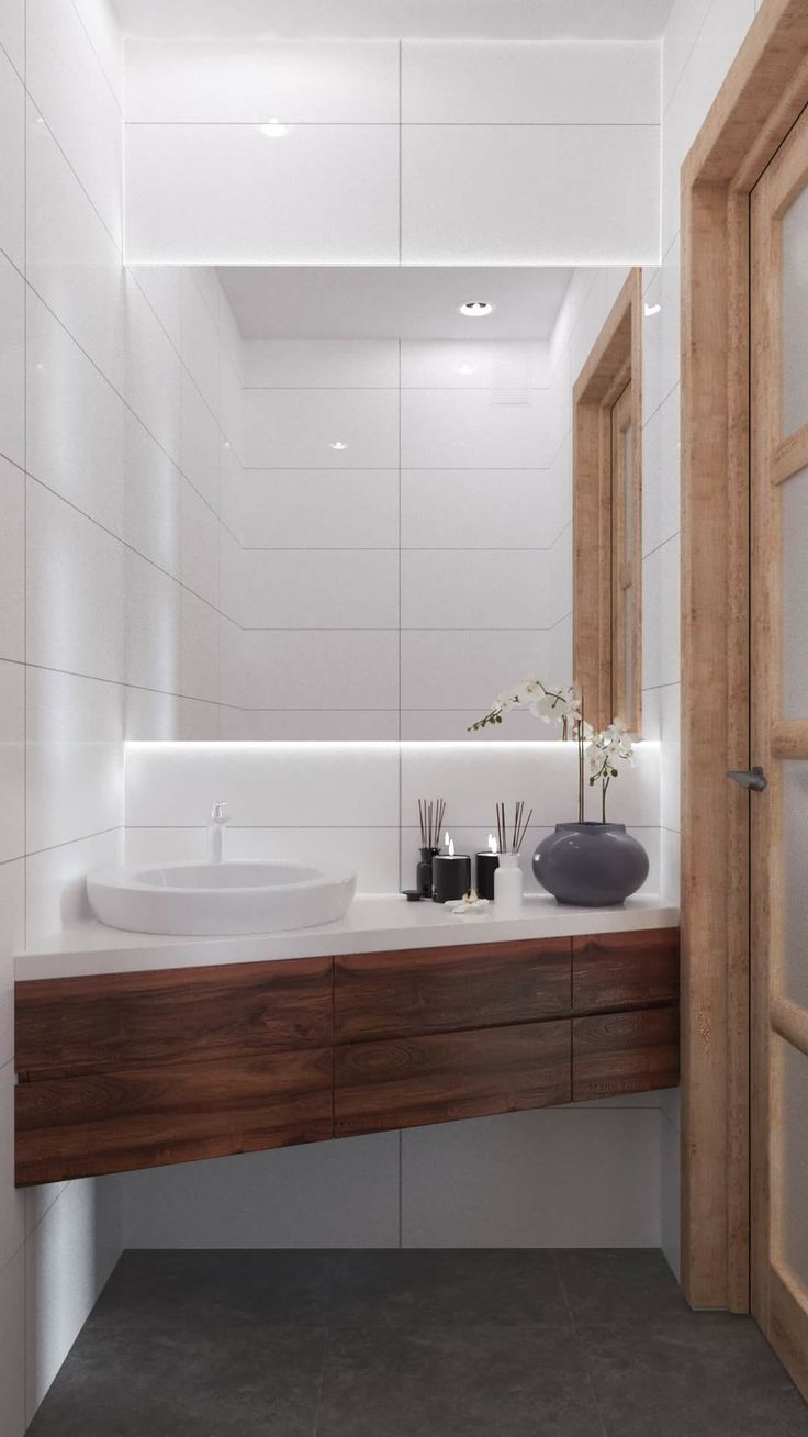 a bathroom with two sinks and a wooden door